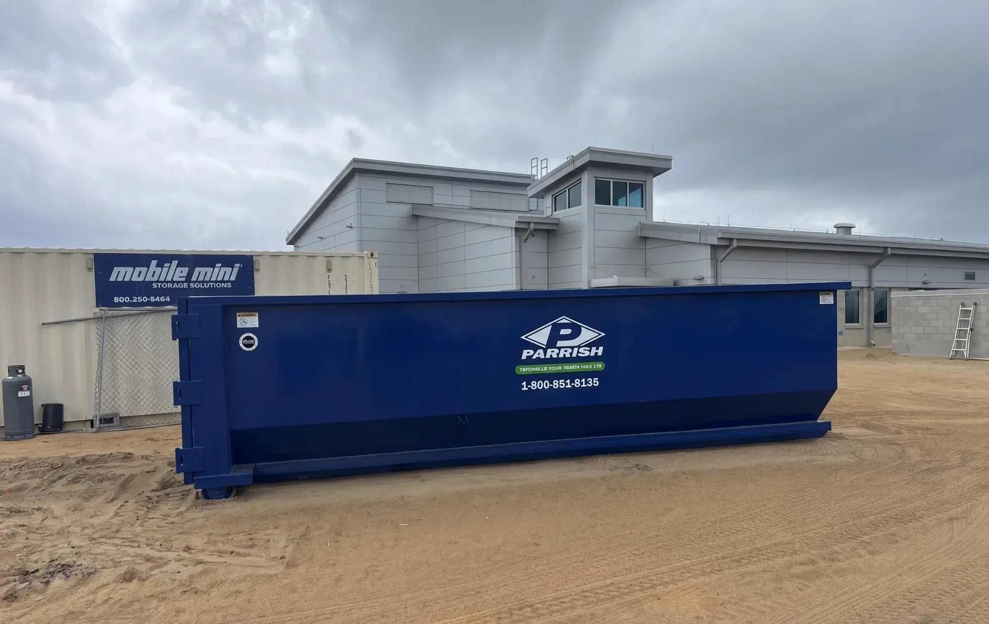 Parrish roll off dumpster on a commercial construction site